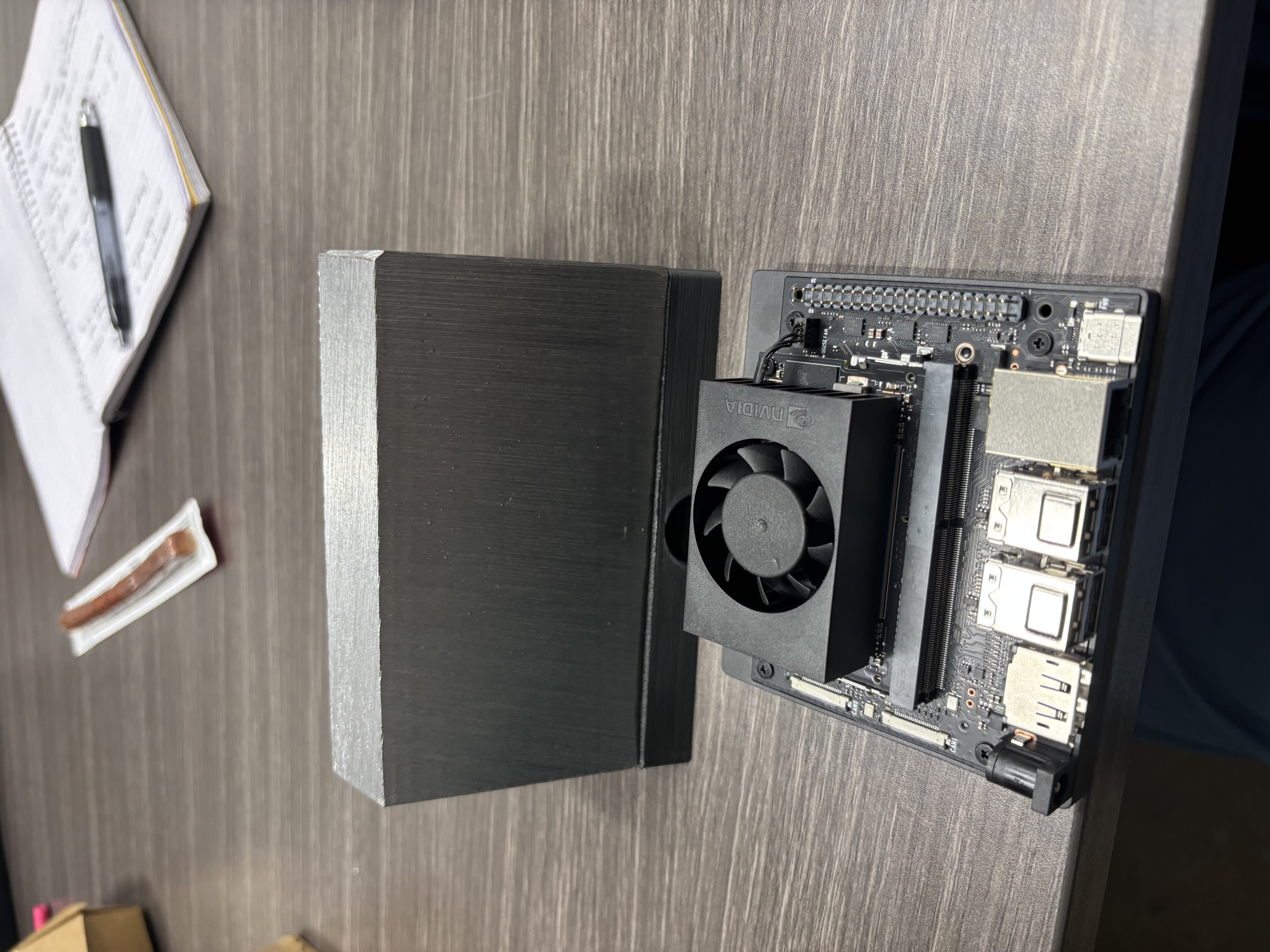 NVIDIA Jetson edge computer next to the machined steel anchor